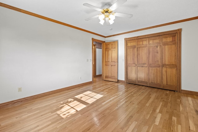 unfurnished bedroom with ceiling fan, light wood-type flooring, a closet, and ornamental molding