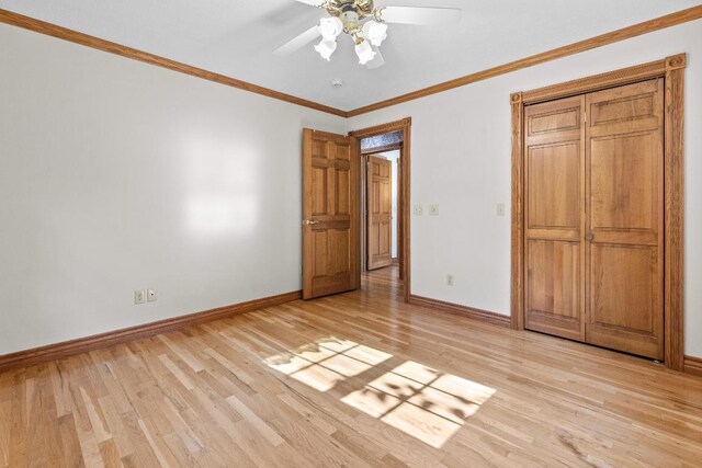 unfurnished bedroom with light hardwood / wood-style floors, crown molding, and ceiling fan