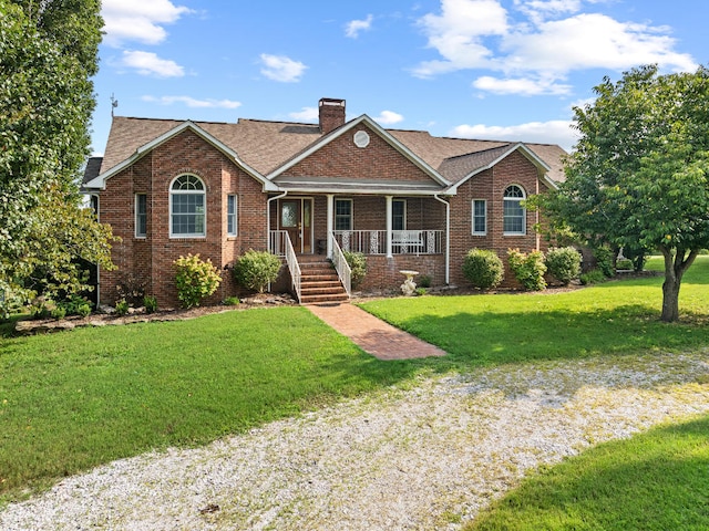 ranch-style home with a porch and a front yard