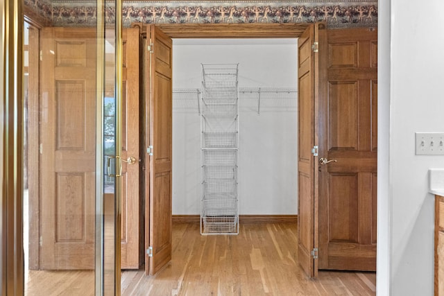 hallway with light wood-type flooring