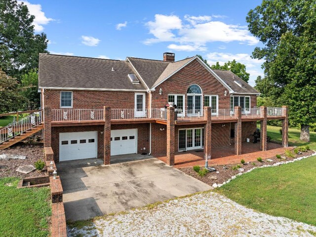 exterior space with a lawn and a garage