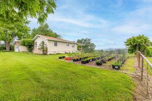 view of yard with a garden and fence