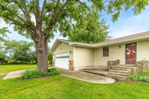 view of front of home featuring a garage and a front lawn