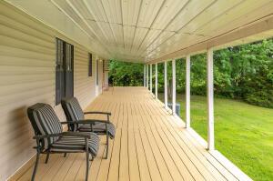 wooden deck with a yard