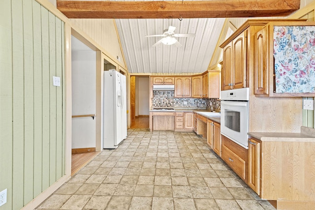 kitchen featuring decorative backsplash, lofted ceiling with beams, white appliances, wooden ceiling, and ceiling fan