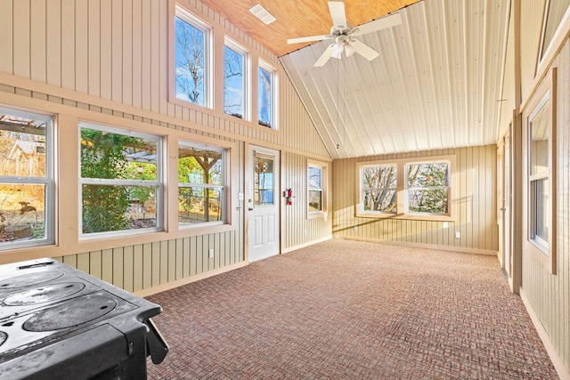 sunroom featuring ceiling fan, vaulted ceiling, and wooden ceiling