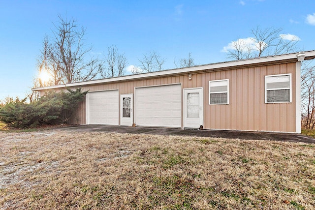 garage featuring wooden walls