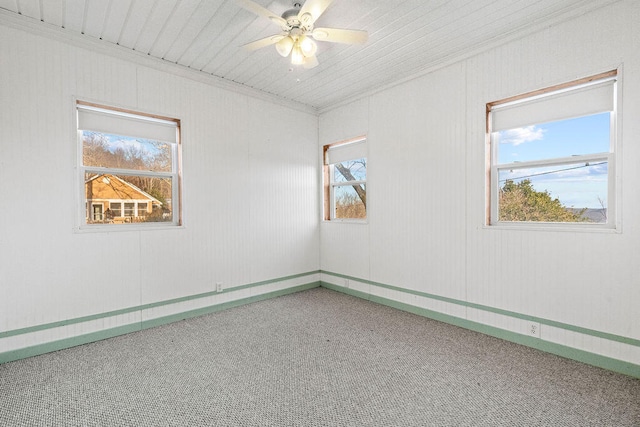 carpeted empty room with ceiling fan, wooden ceiling, and a healthy amount of sunlight