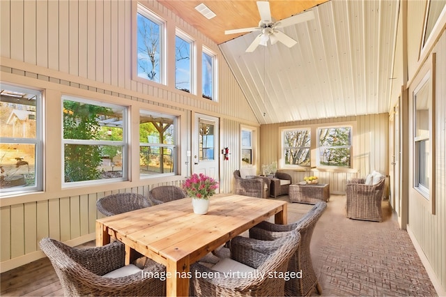 sunroom / solarium featuring wooden ceiling, vaulted ceiling, and ceiling fan