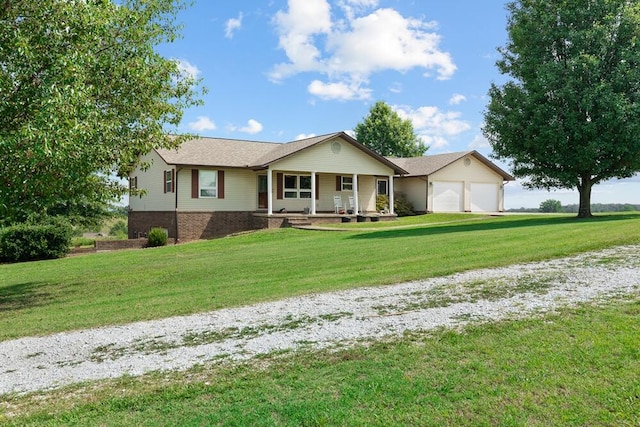 ranch-style home featuring a front yard, a garage, and covered porch