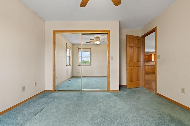 unfurnished bedroom with carpet flooring, ceiling fan, and a closet