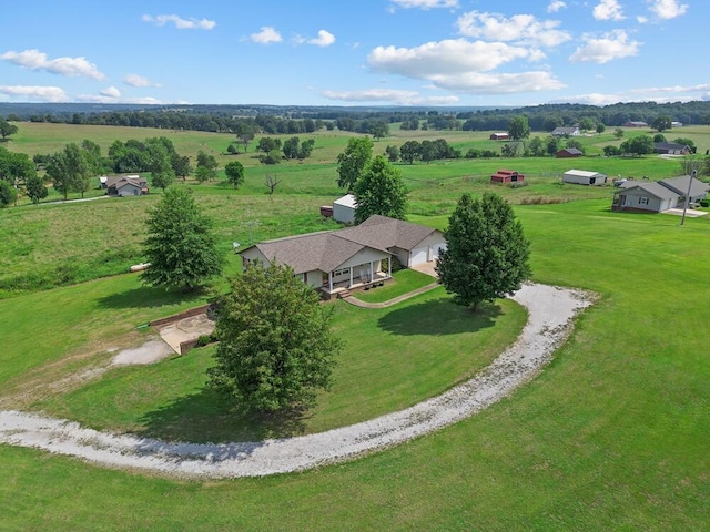 birds eye view of property with a rural view