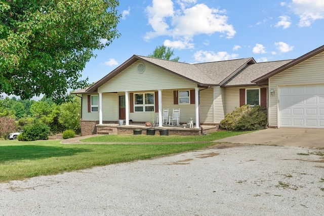 ranch-style house featuring a garage and a front lawn