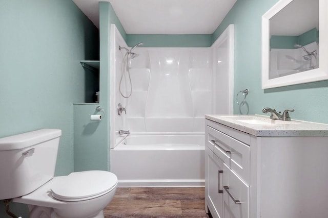 full bathroom featuring hardwood / wood-style flooring, shower / tub combination, toilet, and vanity