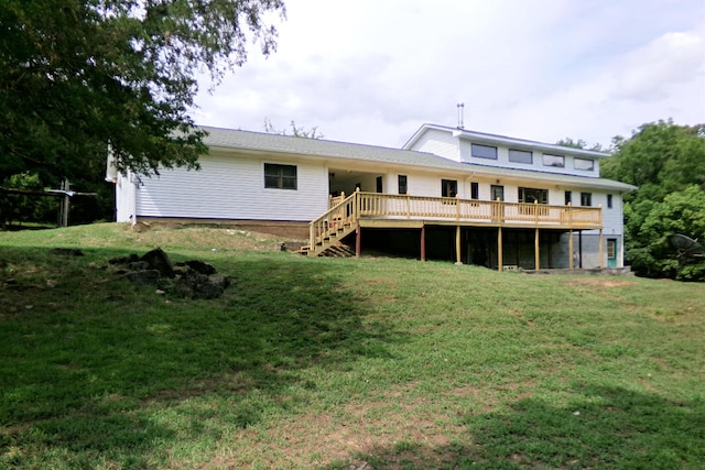 back of house with a lawn and a wooden deck