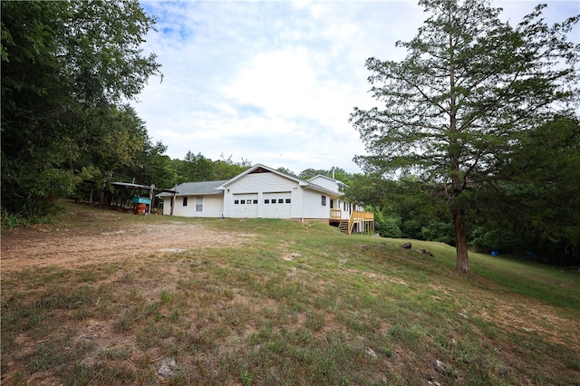 view of yard featuring a garage