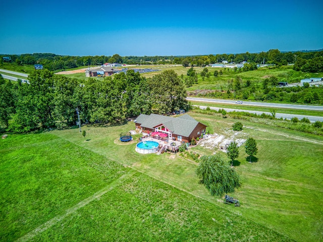 birds eye view of property with a rural view