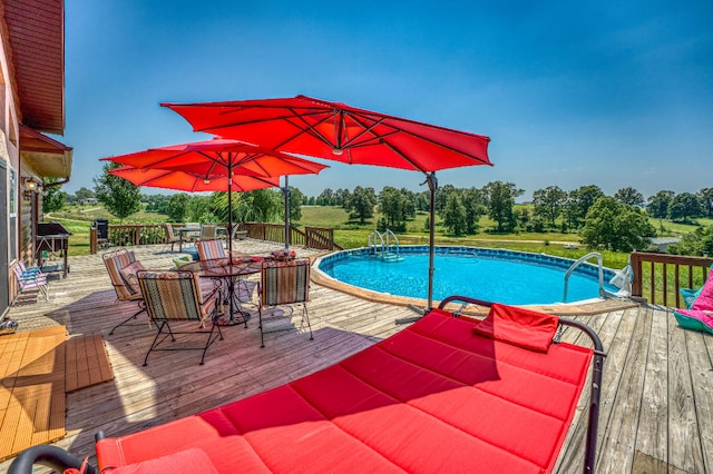 view of swimming pool featuring a wooden deck