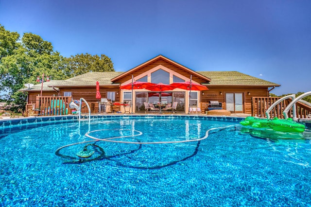 view of pool with a water slide