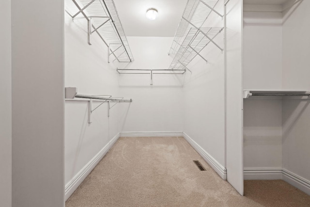 spacious closet featuring carpet floors and visible vents