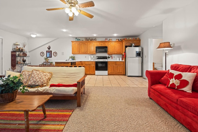 living area with light tile patterned floors, light carpet, a ceiling fan, and recessed lighting