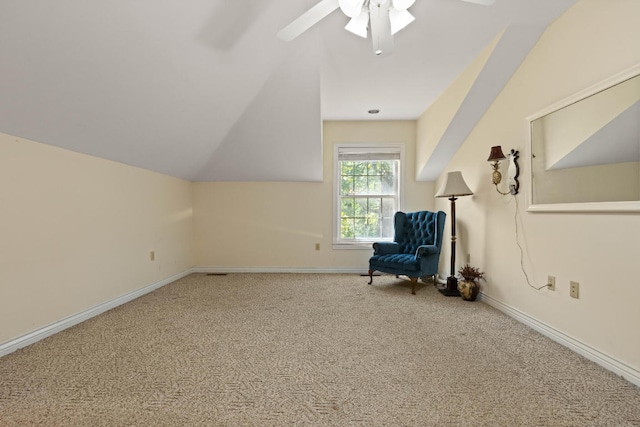 unfurnished room featuring lofted ceiling, ceiling fan, carpet, and baseboards