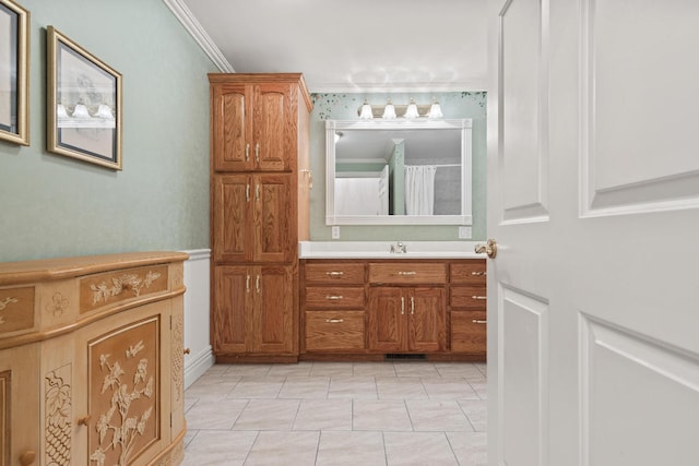 bathroom with vanity and crown molding