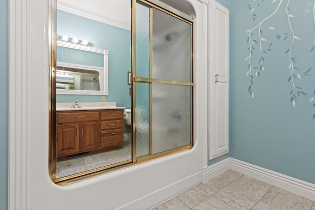 full bath with enclosed tub / shower combo, vanity, baseboards, tile patterned floors, and crown molding