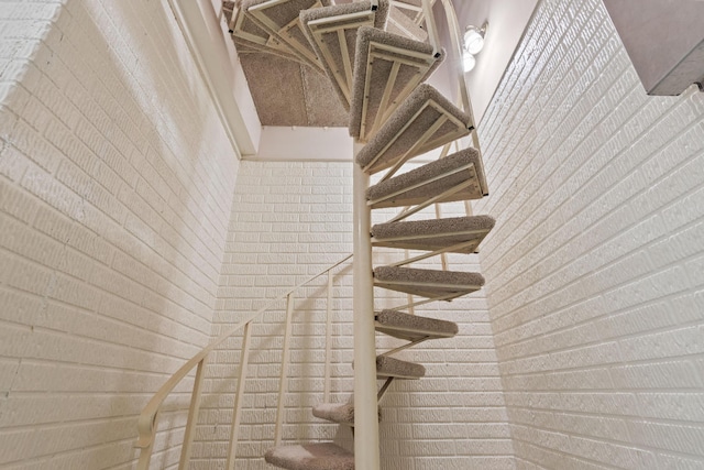 stairway with brick wall