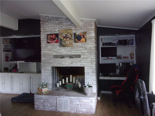 living room with hardwood / wood-style floors, vaulted ceiling with beams, and brick wall