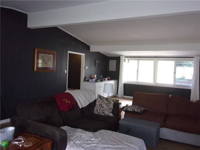 living room with lofted ceiling with beams