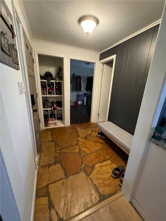 interior space featuring hardwood / wood-style flooring and ornamental molding