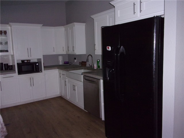 kitchen with white cabinets, sink, dark hardwood / wood-style flooring, and black appliances