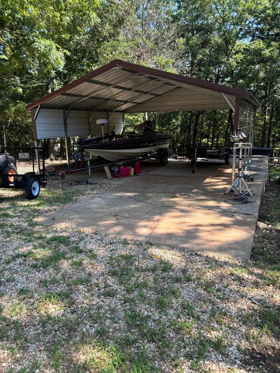 view of parking with a carport