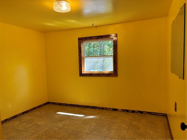 empty room featuring light tile patterned floors