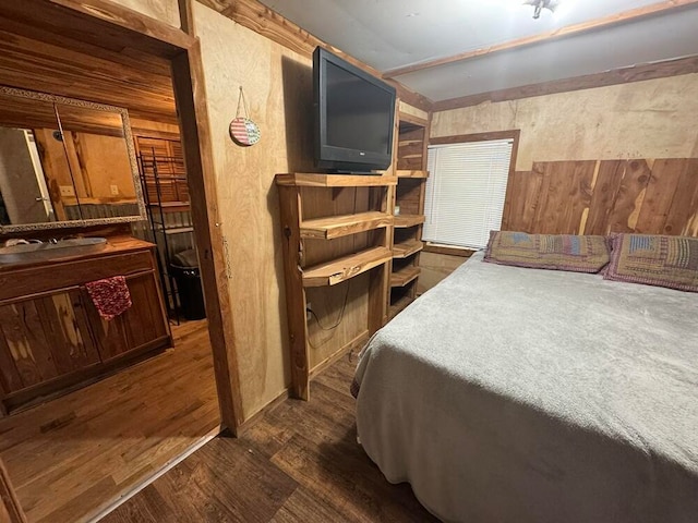 bedroom with dark hardwood / wood-style floors