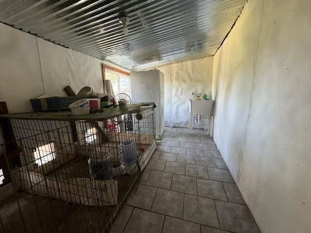 hall featuring tile patterned flooring