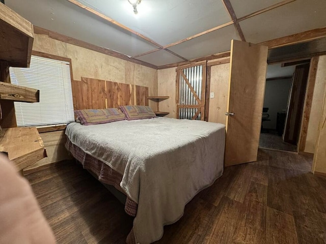 bedroom with dark wood-type flooring