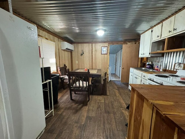 kitchen with sink, a wall mounted air conditioner, dark hardwood / wood-style floors, wooden walls, and electric stove