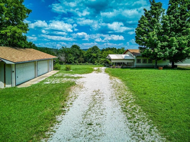 view of road featuring gravel driveway