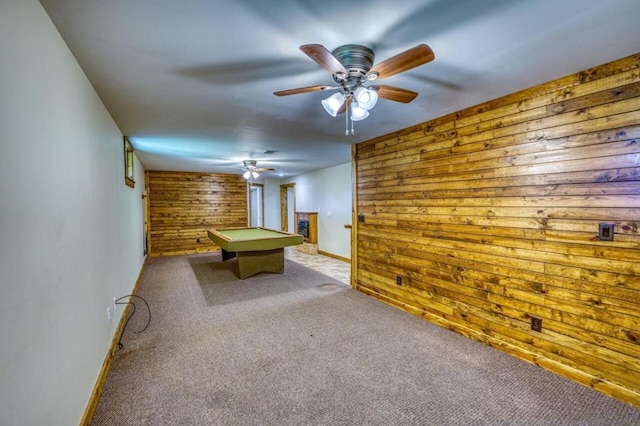 game room with pool table, carpet, baseboards, and wood walls