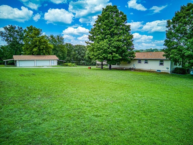 view of yard with an outbuilding and a garage