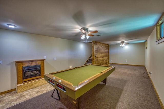 game room with a glass covered fireplace, carpet, baseboards, and a ceiling fan