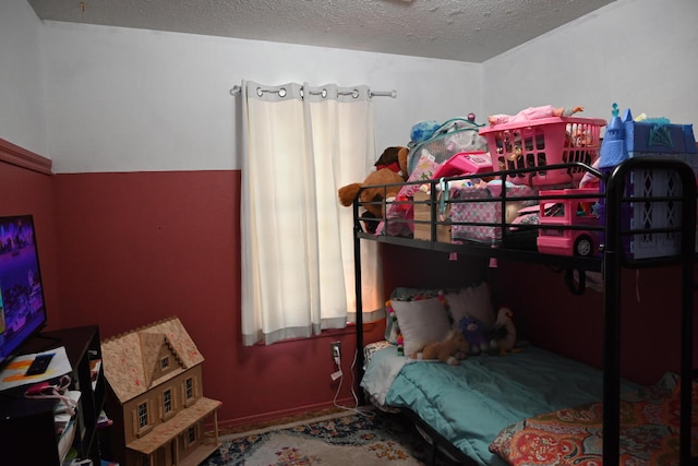 bedroom featuring a textured ceiling