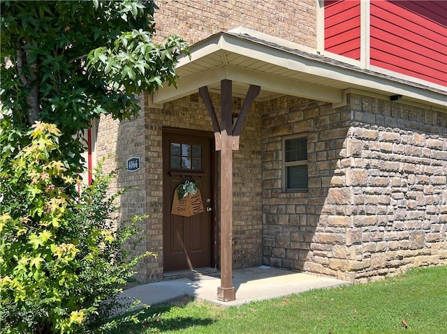 entrance to property with brick siding