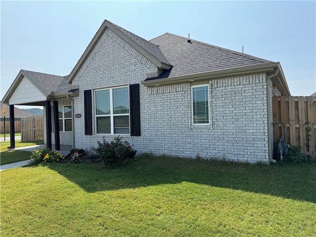 view of property exterior featuring a lawn