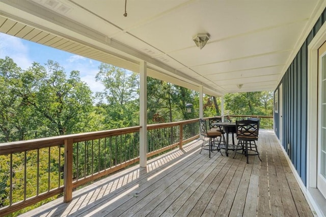 wooden deck featuring outdoor dining space