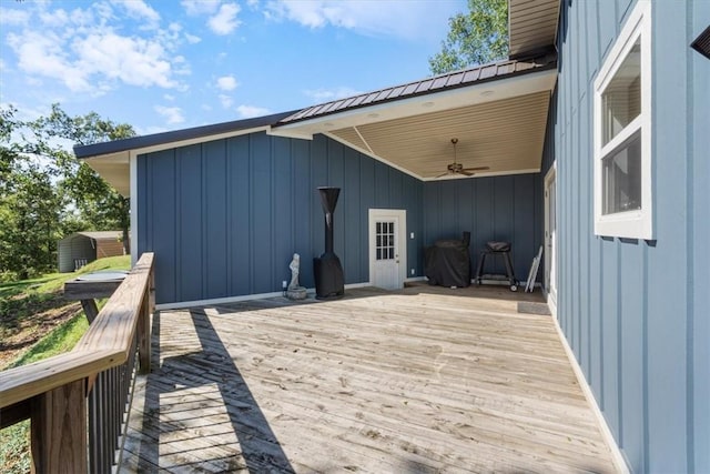 wooden terrace featuring ceiling fan