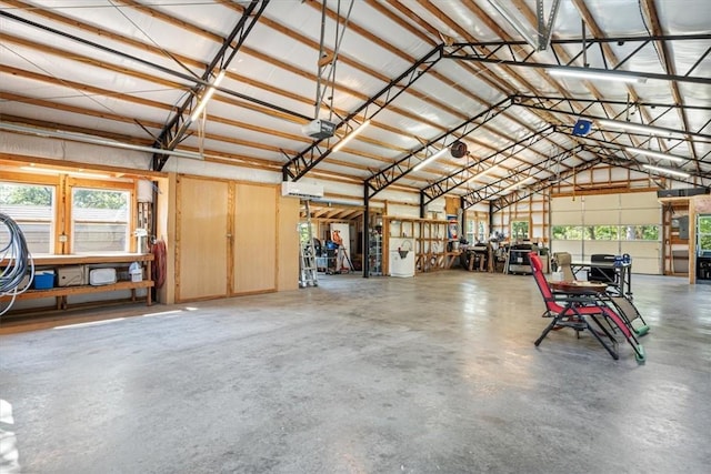 garage with metal wall and a garage door opener