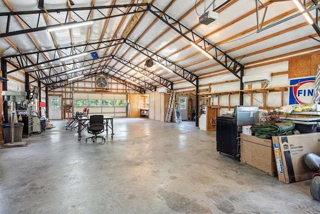 garage featuring metal wall and a garage door opener